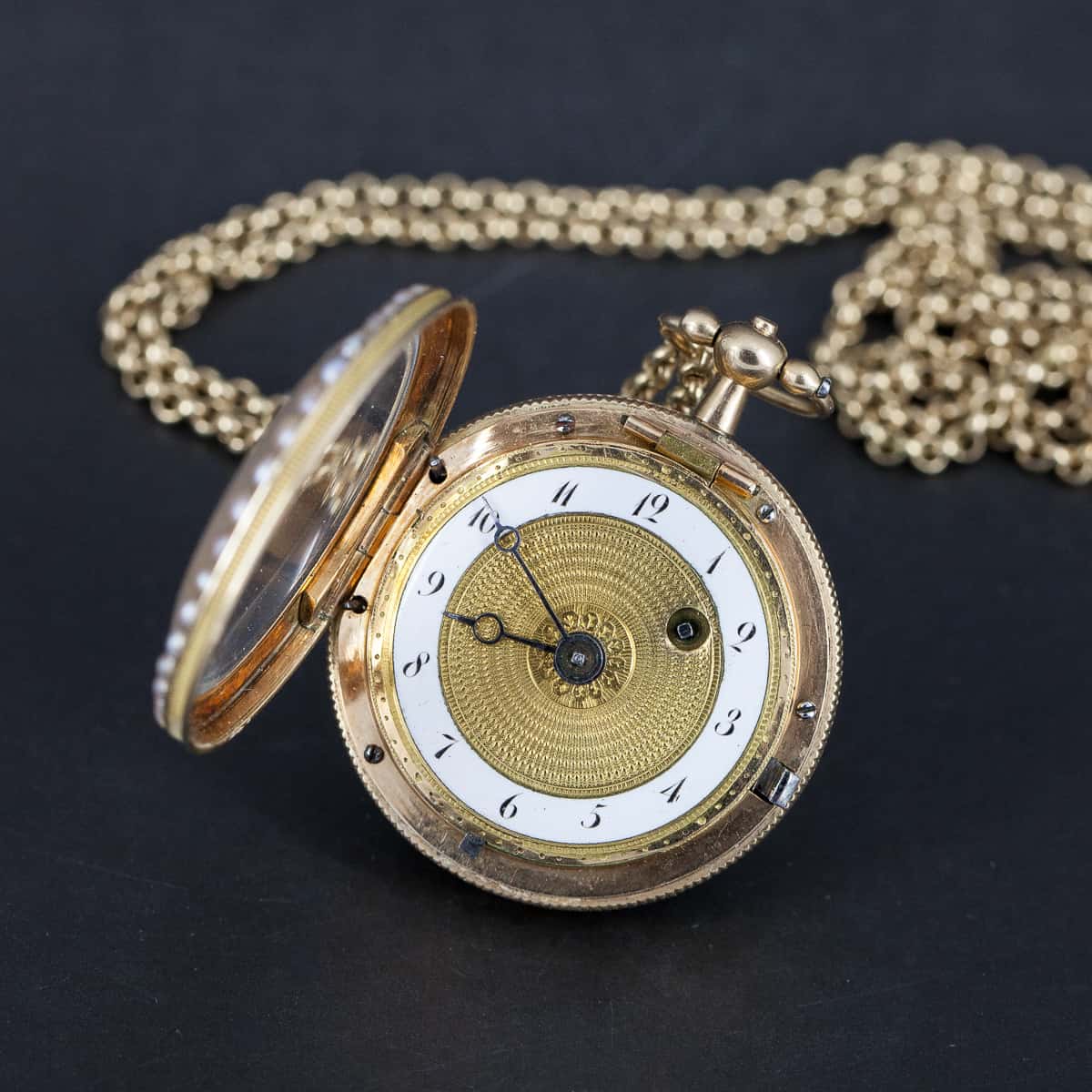 Golden pendant watch with enamel and pearl decorations, Switzerland, approximately 1800
